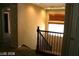 Staircase with wrought iron railing and a window with wood blinds at 1837 Ardilea St, Las Vegas, NV 89135