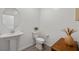 Modern powder room featuring a sleek pedestal sink and stylish decor at 207 Callen Falls Ave # 1713, Henderson, NV 89011
