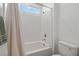 Clean white bathroom featuring a shower-tub combination with tiled walls and modern fixtures at 207 Callen Falls Ave # 1713, Henderson, NV 89011