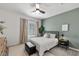 Cozy bedroom showcasing stylish decor, a modern ceiling fan, and a comfortable queen-size bed at 207 Callen Falls Ave # 1713, Henderson, NV 89011