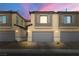 Exterior view of modern townhomes featuring private garages and contemporary design at 207 Callen Falls Ave # 1713, Henderson, NV 89011
