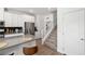 Bright, modern kitchen featuring a large island, stainless steel appliances and stairway at 207 Callen Falls Ave # 1713, Henderson, NV 89011