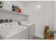 Functional laundry room equipped with a washer and dryer and ample storage space at 207 Callen Falls Ave # 1713, Henderson, NV 89011
