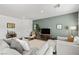 Bright and airy living room showcasing modern furnishings, a large sectional sofa, and tasteful decor at 207 Callen Falls Ave # 1713, Henderson, NV 89011
