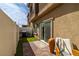 Back patio with outdoor seating, barbecue, and sliding glass doors that lead inside at 207 Callen Falls Ave # 1713, Henderson, NV 89011
