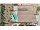 Stunning desert property aerial featuring a modern pool, spa, rock landscaping, and a private backyard oasis at 2197 Big Bar Dr, Henderson, NV 89052