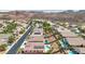 Aerial shot of homes in a desert community with in-ground swimming pools and beautiful desert landscaping at 2197 Big Bar Dr, Henderson, NV 89052
