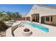 Captivating backyard with a pool, spa, and cozy fire pit, ideal for creating a resort-style outdoor living space at 2197 Big Bar Dr, Henderson, NV 89052