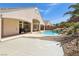 Beautiful backyard showcasing a pool with serene water features, complemented by an expansive patio, ideal for relaxation at 2197 Big Bar Dr, Henderson, NV 89052