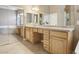 Bright bathroom features dual sinks, granite countertops, bathtub and tile flooring at 2197 Big Bar Dr, Henderson, NV 89052
