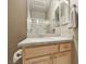 Well-lit bathroom featuring a marble vanity top and a glass door shower at 2197 Big Bar Dr, Henderson, NV 89052