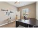Comfortable bedroom with a ceiling fan, natural light, and desk area at 2197 Big Bar Dr, Henderson, NV 89052