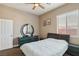 Well-lit bedroom with a queen bed, closet, carpet and a window at 2197 Big Bar Dr, Henderson, NV 89052