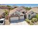 Attractive single-Gathering home with a three-car garage, well-manicured lawn, and appealing curb appeal in a quiet neighborhood at 2197 Big Bar Dr, Henderson, NV 89052