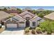 Beautiful single Gathering home with desert landscaping and a three car garage at 2197 Big Bar Dr, Henderson, NV 89052