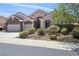 Beautiful single-story house with a three-car garage and well-maintained front yard at 2197 Big Bar Dr, Henderson, NV 89052