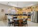 Bright, modern kitchen with stainless steel appliances, granite countertops, and island seating at 2197 Big Bar Dr, Henderson, NV 89052