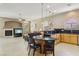 Open-concept kitchen flowing into the living area, featuring a breakfast bar and modern appliances at 2197 Big Bar Dr, Henderson, NV 89052