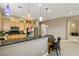 Spacious kitchen features pendant lighting, breakfast bar and stainless steel appliances at 2197 Big Bar Dr, Henderson, NV 89052