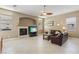 Spacious living room featuring a fireplace and large windows at 2197 Big Bar Dr, Henderson, NV 89052