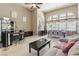 Open-concept living area featuring high ceilings, tile floors, and a built-in bar at 2197 Big Bar Dr, Henderson, NV 89052