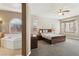 Serene main bedroom leading to an attached bathroom featuring a jacuzzi tub at 2197 Big Bar Dr, Henderson, NV 89052
