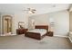 Elegant main bedroom with warm tones, a ceiling fan, and a large dresser at 2197 Big Bar Dr, Henderson, NV 89052