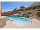 Backyard pool featuring a waterfall and lush landscaping at 2197 Big Bar Dr, Henderson, NV 89052