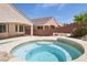 Inviting backyard with a sparkling pool and spa, perfect for outdoor relaxation and entertainment in sunny weather at 2197 Big Bar Dr, Henderson, NV 89052