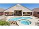 Beautiful backyard featuring a pool and spa with rock details, creating a serene outdoor oasis for relaxation at 2197 Big Bar Dr, Henderson, NV 89052
