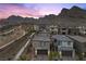 Twilight aerial view of Crested Canyon neighborhood showing the architectural design of the homes at 2367 Ridgeline Wash St, Las Vegas, NV 89138