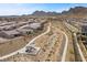 High angle aerial view showing Crested Canyon homes, walking paths, and a shaded picnic area at 2367 Ridgeline Wash St, Las Vegas, NV 89138