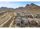 Real estate aerial view capturing the neighborhood landscape and surrounding mountains at 2367 Ridgeline Wash St, Las Vegas, NV 89138