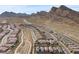 Scenic aerial view of Crested Canyon homes amidst a desert landscape and mountain range at 2367 Ridgeline Wash St, Las Vegas, NV 89138