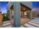 Inviting covered backyard patio with pavers and stepping stones to an outdoor seating area at 2367 Ridgeline Wash St, Las Vegas, NV 89138