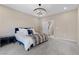 Bedroom showcasing a modern chandelier, neutral walls, and carpeted floors at 2367 Ridgeline Wash St, Las Vegas, NV 89138