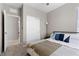 Cozy bedroom featuring a comfortable bed, closet, and doorway leading to other parts of the house at 2367 Ridgeline Wash St, Las Vegas, NV 89138
