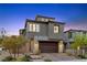 Charming two-story home featuring stone accents, a two-car garage, and a beautifully landscaped front yard at 2367 Ridgeline Wash St, Las Vegas, NV 89138