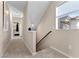 Bright hallway with neutral walls leads to bedroom; window offers natural light at 2367 Ridgeline Wash St, Las Vegas, NV 89138