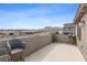 Spacious patio with comfortable seating, offering expansive views of the surrounding mountains and community at 2367 Ridgeline Wash St, Las Vegas, NV 89138