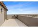 Inviting patio with cozy seating, providing panoramic views of the desert landscape and clear blue sky at 2367 Ridgeline Wash St, Las Vegas, NV 89138