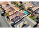 Aerial view of a neighborhood featuring a house with a pool and solar panels at 2470 Lothian St, Henderson, NV 89044