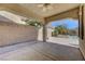 Covered back patio with palm trees and sparkling pool views at 2470 Lothian St, Henderson, NV 89044
