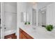 Bathroom featuring a vanity with drawers, a large mirror, and a view into an adjacent room at 2470 Lothian St, Henderson, NV 89044