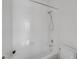 Bright bathroom featuring a white shower-tub combo and minimalist design at 2470 Lothian St, Henderson, NV 89044