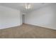 Large bedroom with carpet flooring, ceiling fan with light, and neutral walls at 2470 Lothian St, Henderson, NV 89044