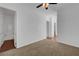 Bedroom with neutral carpet, white walls, and an open doorway to an attached bathroom at 2470 Lothian St, Henderson, NV 89044