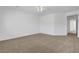 Large bedroom with carpet flooring, ceiling fan with light, and neutral walls at 2470 Lothian St, Henderson, NV 89044