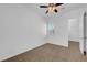 Bright bedroom featuring plush carpeting, a ceiling fan, and a window with white shutters at 2470 Lothian St, Henderson, NV 89044