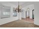 Well-lit dining room featuring an elegant chandelier, perfect for hosting dinners and celebrations at 2470 Lothian St, Henderson, NV 89044